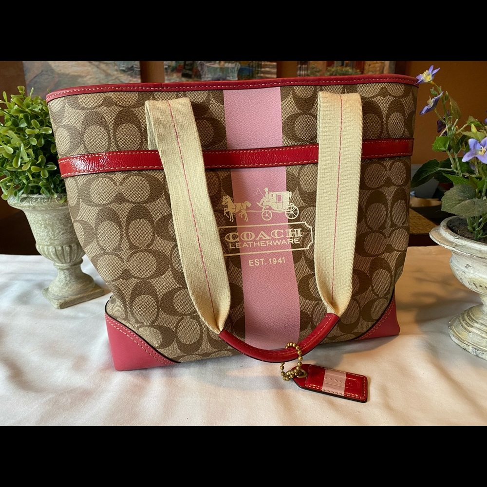 Large pink and brown Coach tote bag